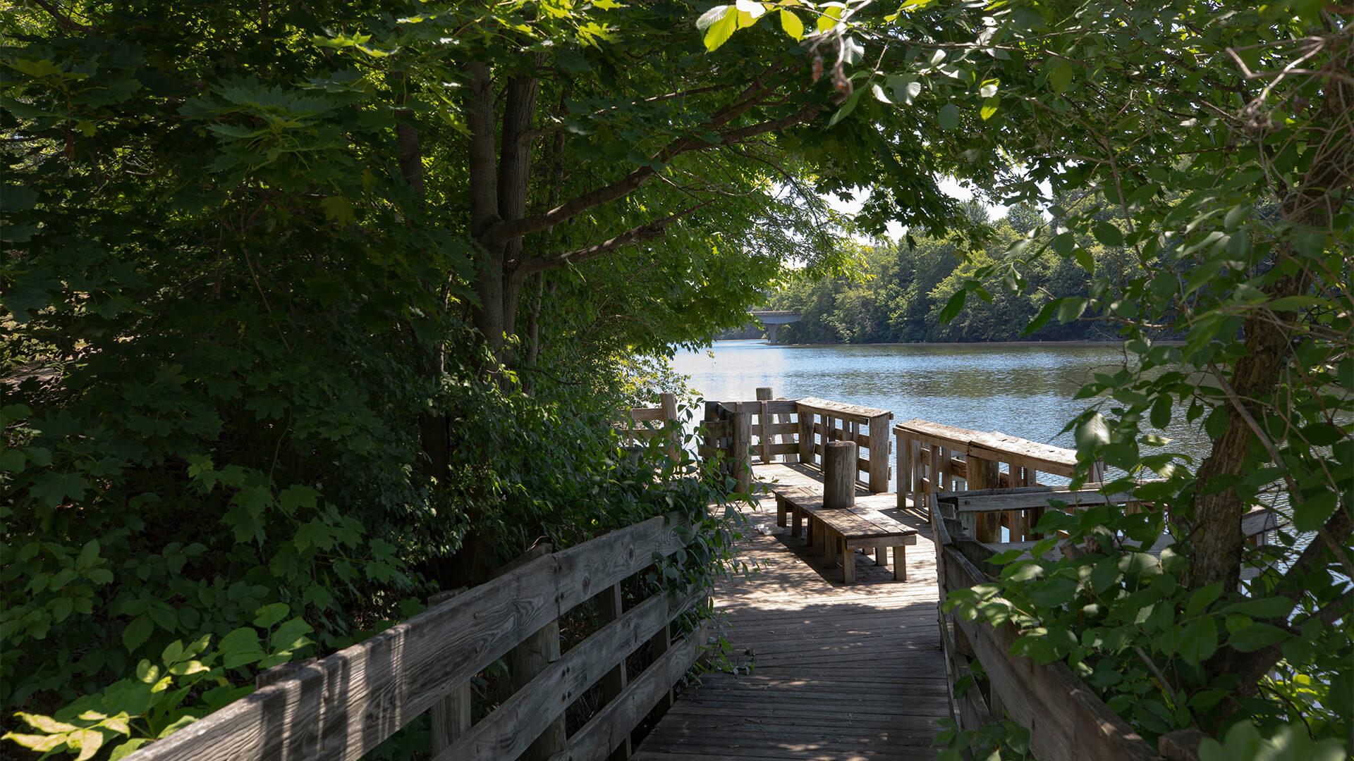 shaded walkway overlooking a river